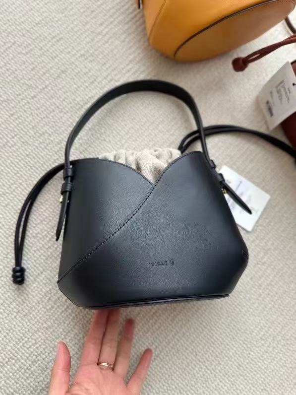 2025 New Black Niche Retro Cowhide Lucky Bag Vegetable Basket Bucket Bag Women's Minimalist Drawstring Canvas Inner Pocket Wrist Handbag